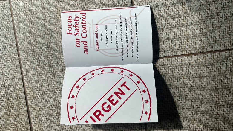 Some of the documents in a local attorney’s departure preparation for Haitians, in case TPS ends and they have to leave. Photos by Wedly Cazy