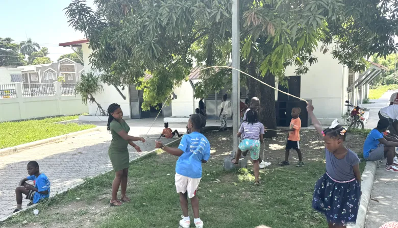 Children jump rope in the courtyard of Lycée Anacaona during “Let’s Play Together” on Saturday, Aug. 15, 2026, in Léogâne, Haiti. Photo by Daniella Saint-Louis for The Haitian Times. 