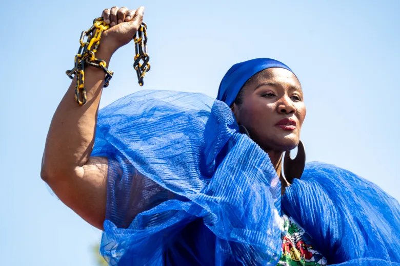 Parade participants ride a float wearing chains, an emblem representing Haitian liberation, at the West Indian Day Parade in Brooklyn, N.Y., Sept. 7, 2026. Photo by Fredner Cayemitte for The Haitian Times.