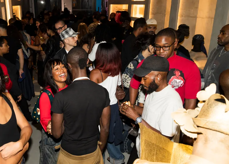 Attendees gather inside the Soho pop-up for Daveed Baptiste’s Converse showcase. Photo by Quadir Ali Moore