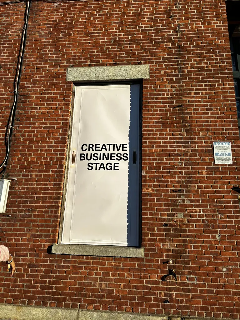 Signage marks the Creative Business Stage at CultureCon 2026 at the Brooklyn Navy Yard in Brooklyn, New York. Photo by Catherine Roth / The Haitian Times