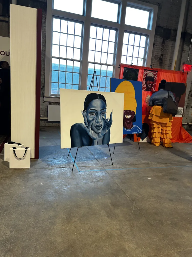 Artworks of participating artists displayed inside CultureCon 2026 at the Brooklyn Navy Yard in Brooklyn, New York. Photo by Catherine Roth / The Haitian Times
