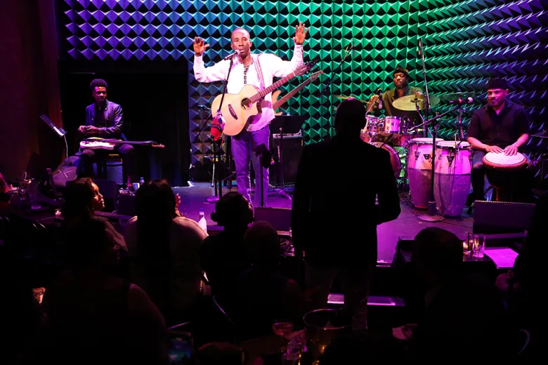 Haitian singer-songwriter BéLo on stage with musicians Ragganga. Dony Felix, on bass, Harvek Nakundi on drums imbued the classic tunes with added thump, Dony Felix, Robertson played ferocious guitar solos while Okai was on tambour and percussion.